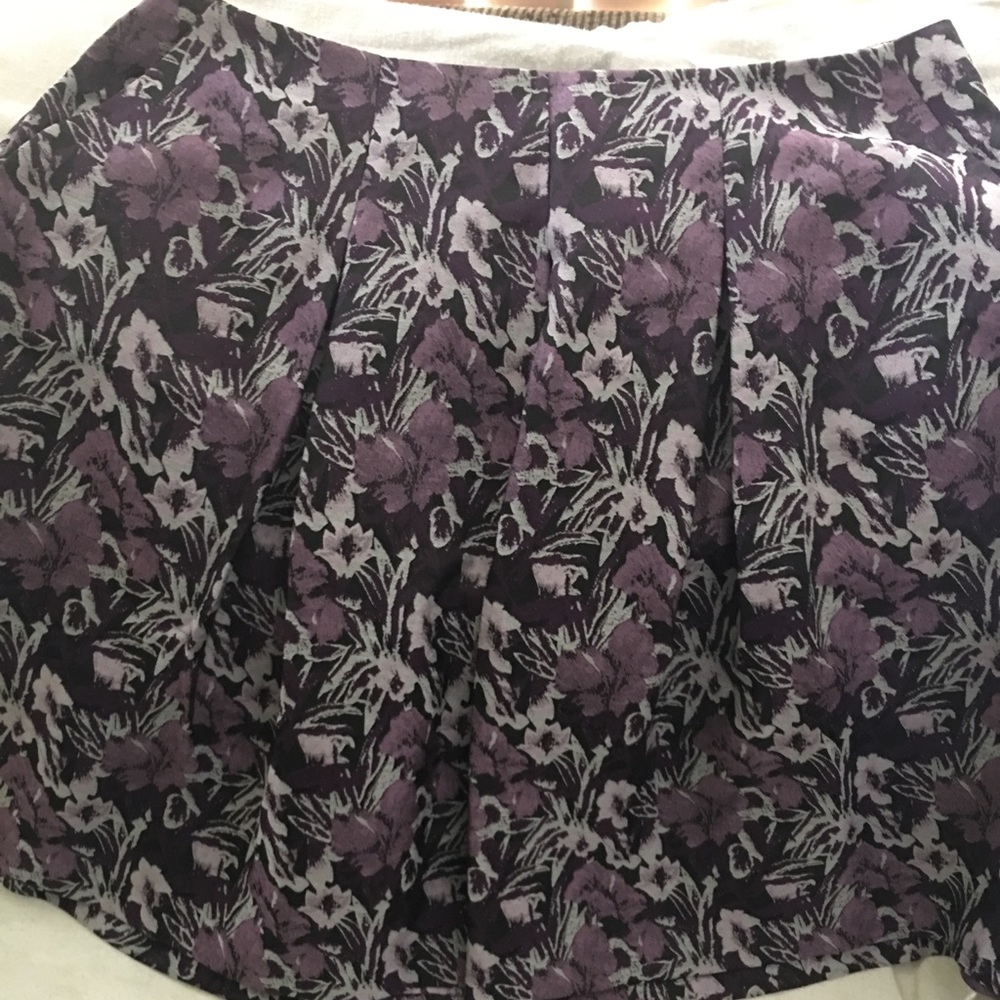 Purple, pocketed, pleated skirt.